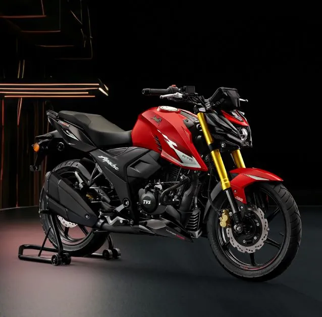 Red TVS Apache RTR on a paddock stand